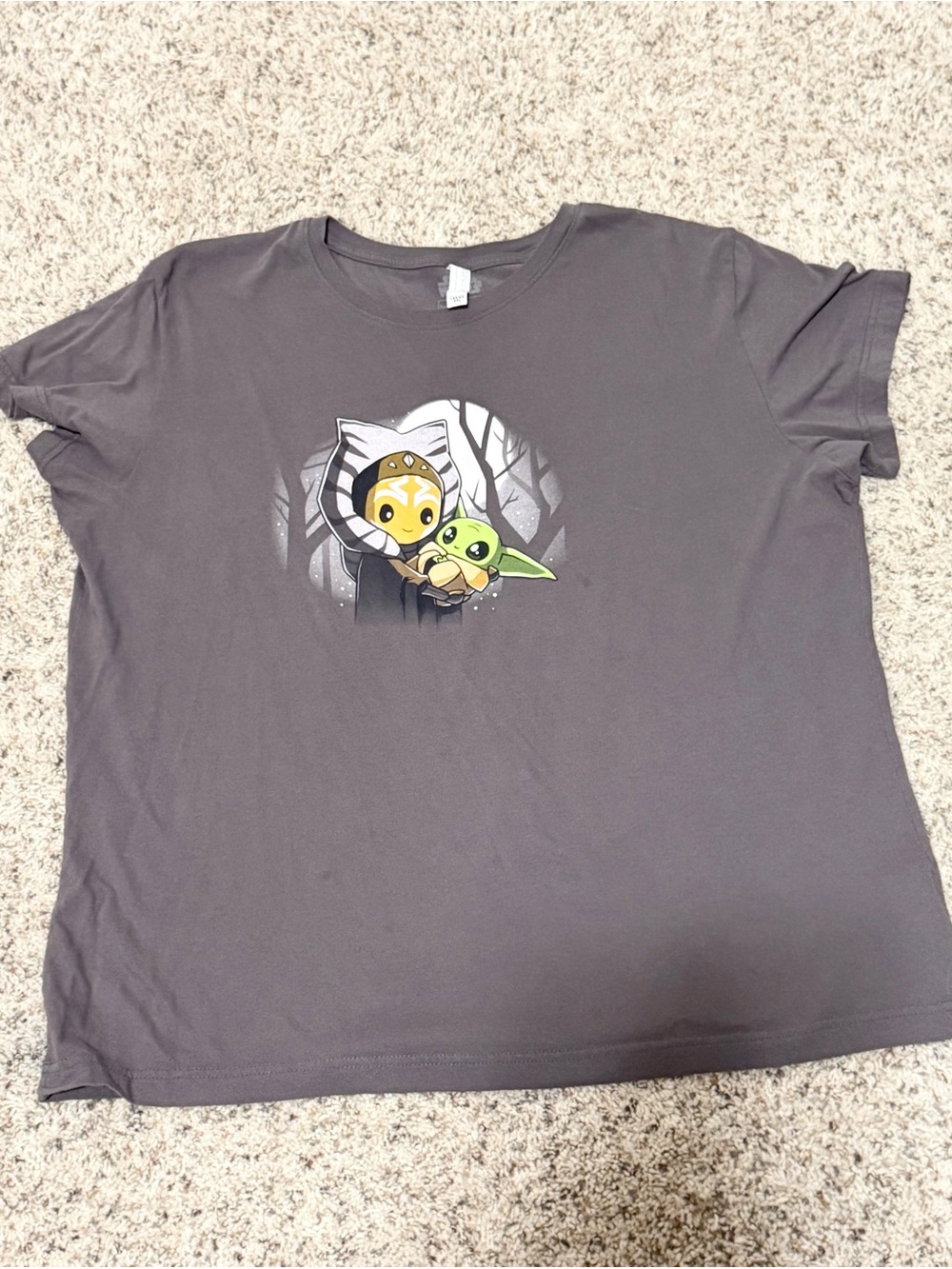 Gray Star Wars graphic t-shirt illustration of Ahsoka Tano holding Grogu